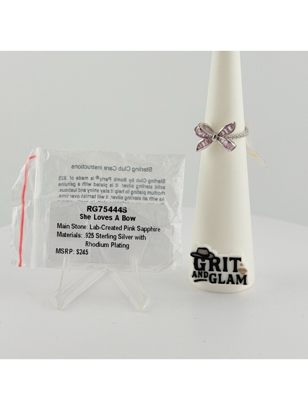 Bomb Party Sterling Club Sz 7 "She Loves A Bow” Pink Sapphire on .925 W/ Rhodium - Picture 2 of 6
